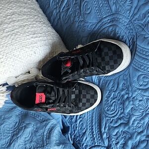 Black on black checkered Vans